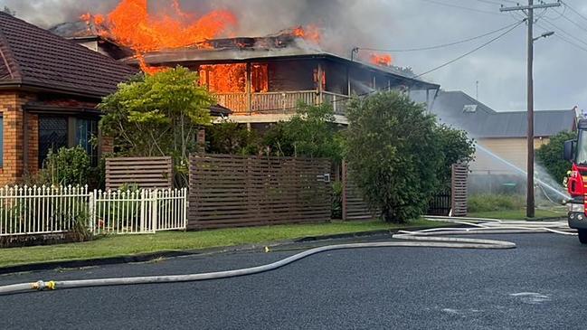 A two-storey home on River Street, Taree, fully engulfed by flames.