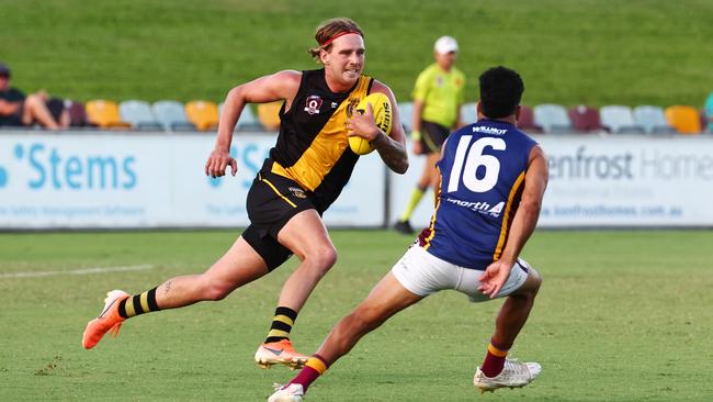 Tigers' Hayden Spiller charges down the field in the AFL Cairns premiership men's preliminary final match between the Cairns City Lions and the North Cairns Tigers, held at Cazalys Stadium, Westcourt. Picture: Brendan Radke