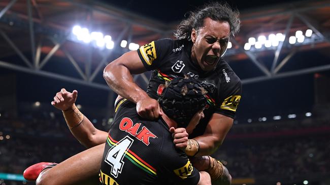 Jarome Luai celebrates with Matt Burton after Burton’s try (Photo by Bradley Kanaris/Getty Images)