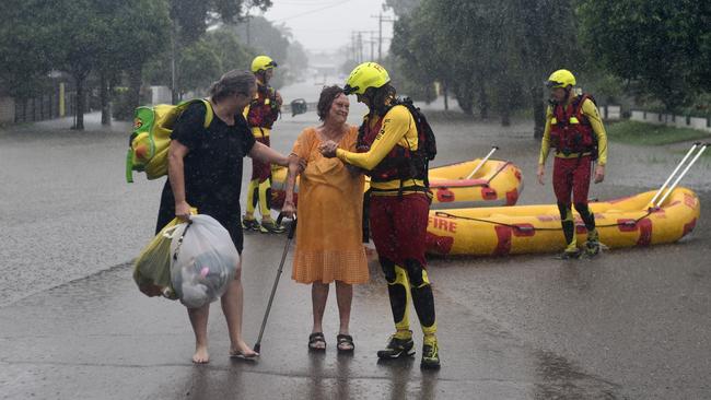 2019: Townsville Floods. Lyndell Goodall and Shirly Mather are evacuated from their Hermit Park Hodel St home. Picture: Evan Morgan