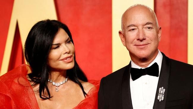 Executive chairman of Amazon Jeff Bezos and girlfriend US actress Lauren Sanchez attend the Vanity Fair Oscars Party at the Wallis Annenberg Center for the Performing Arts in Beverly Hills, California, on March 10, 2024. (Photo by Michael TRAN / AFP)