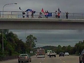 Why people are waving flags at M1 bridges