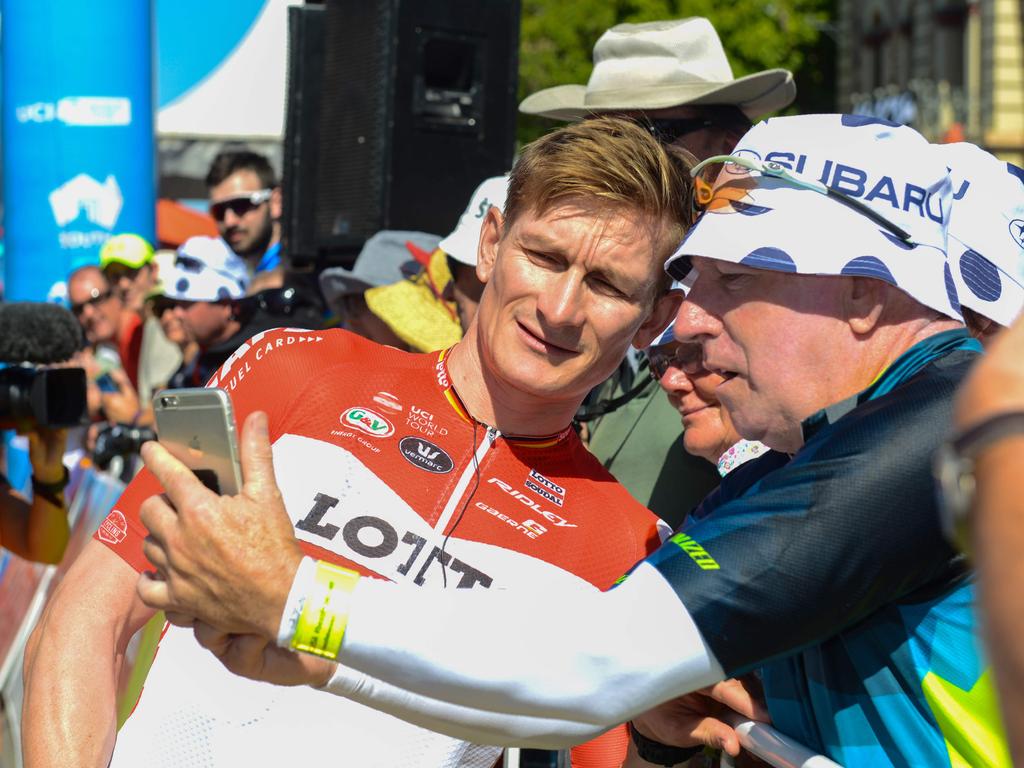 Andre Greipel from Lotto Soudal looks at a photo by a spectator Picture: Brenton Edwards/AFP Photo