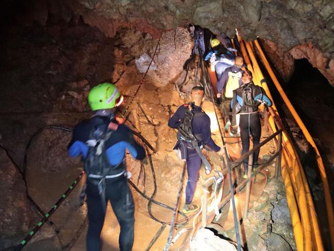 The Thai Navy divers descend into the cave for one of the three rescue operations. Picture: AFP / Royal Thai Navy