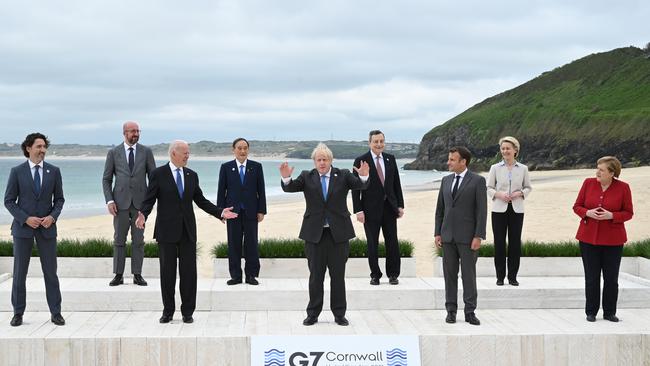 (L-R) Canadian Prime Minister Justin Trudeau, President of the European Council Charles Michel, US President Joe Biden, Japanese Prime Minister Yoshihide Suga, British Prime Minister Boris Johnson, Italian Prime Minister Mario Draghi, French President Emmanuel Macron, President of the European Commission Ursula von der Leyen and German Chancellor Angela Merkel, pose at for the leaders’ picture at Carbis Bay. Picture: Getty Images.