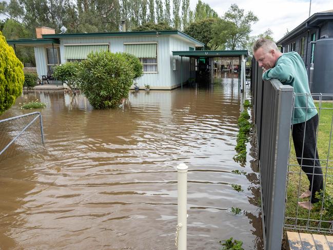 Flooding around the Macalister River flowing out of Lake Glenmaggie, township of Tinamba. Dirk Schmid at his house that was safe from the waters where his elderly neighbour had been evacuated. . Picture: Jason Edwards