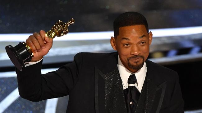 An emotional Smith took the stage to accept his Best Actor Oscar just half an hour after assaulting Rock. Picture: AFP