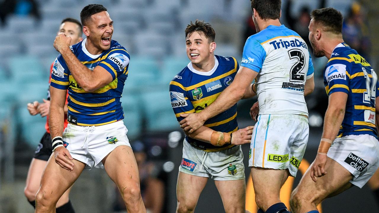 Corey Norman (left) of the Eels reacts after scoring a try against the Titan's during the Round 21 NRL match between the Parramatta Eels and the Gold Coast Titans at ANZ Stadium in Sydney, Saturday, August 4, 2018. (AAP Image/Brendan Esposito)