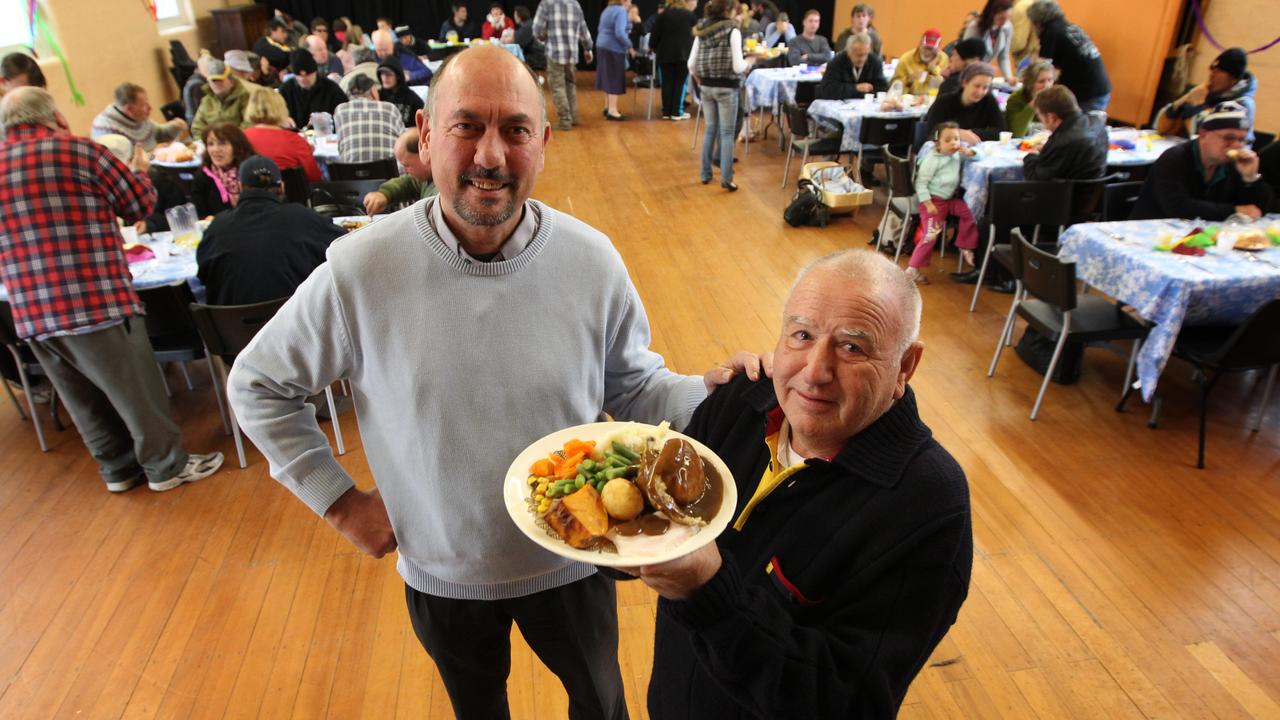 Fr Trickey and Col Hastings celebrate 500,000 charity meals delivered at Christ Church Geelong in 2013. Picture: Ryan Reg