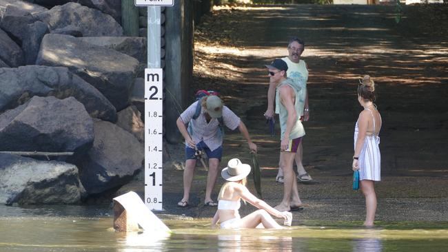 A woman has offered herself up as croc bait after deciding it was a smart idea to sit in the shallows of Cahills Crossing. Picture: Charlotte Nansen