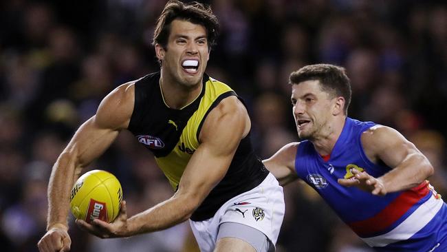 Alex Rance does more than just stop his opponent, he also provides drive off halfback. Picture: Michael Klein