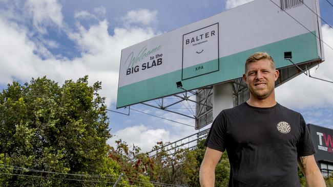 Mick Fanning in front of the Balter Beer "Big Slab" Balter billboard at Yatala. Picture: Jerad Williams