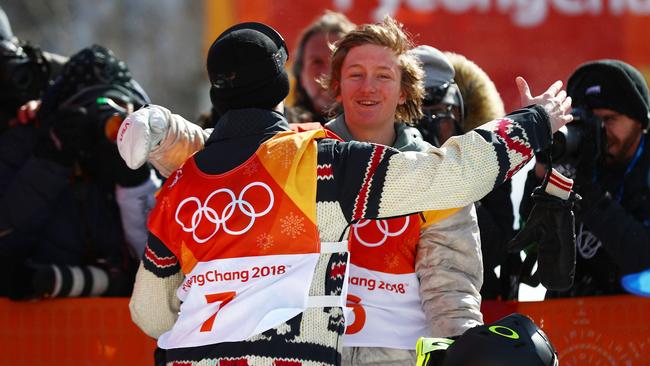 Gold medallist Redmond Gerard, right, of the US, celebrates with silver medalist Max Parrot of Canada during the snowboard men's slopestyle final on day two.