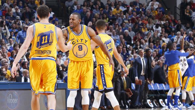 Andre Iguodala and Klay Thompson of the Golden State Warriors react after a basket against the Indiana Pacers in the first half.