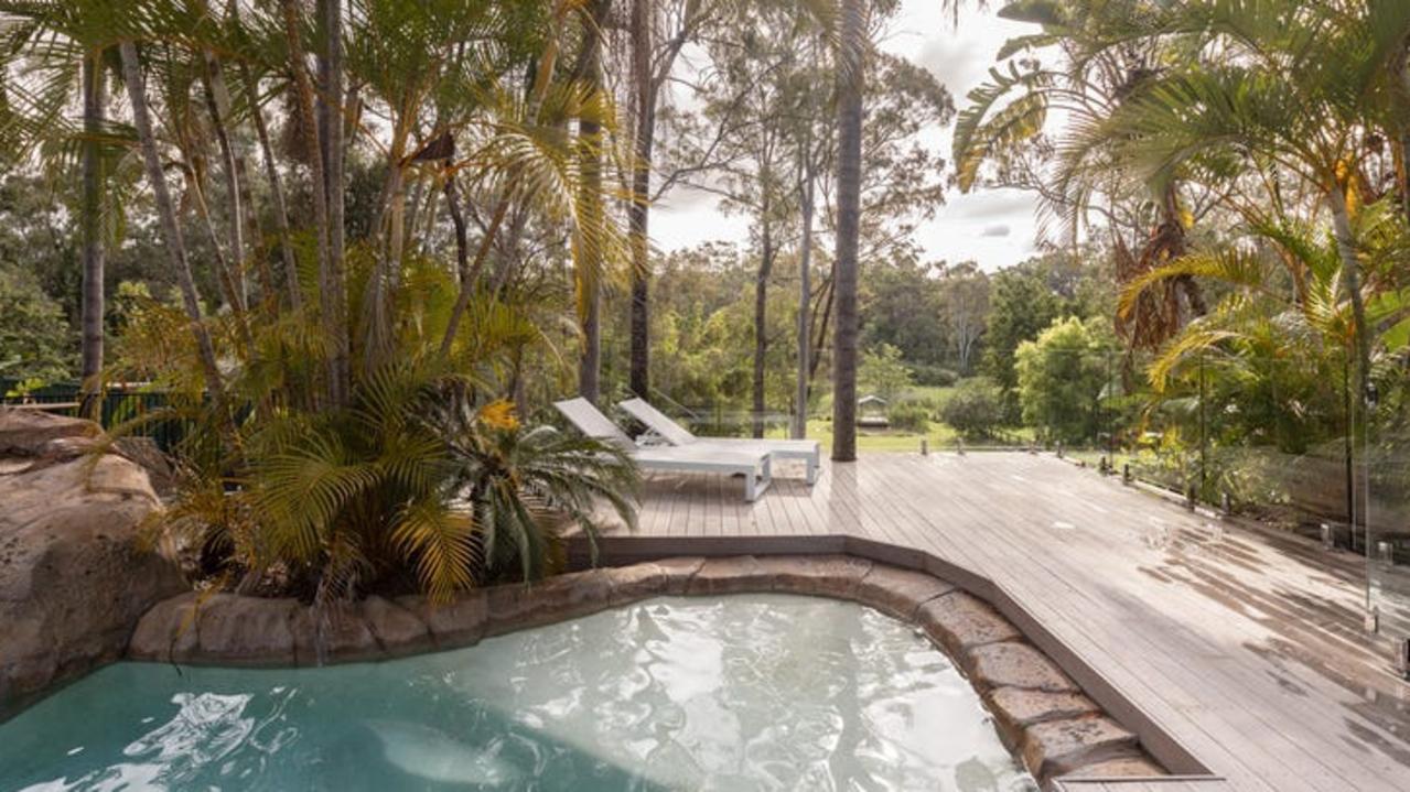 AFTER: The pool has a rock waterfall and slide