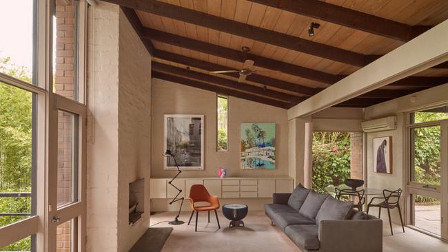 The 1970s features included sloping timber ceiling, exposed beams and the courtyard connections. Picture: Josh Robenstone