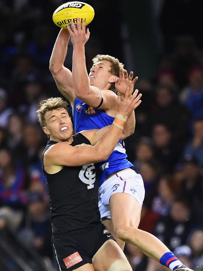 Aaron Naughton marks over the top of Patrick Cripps.