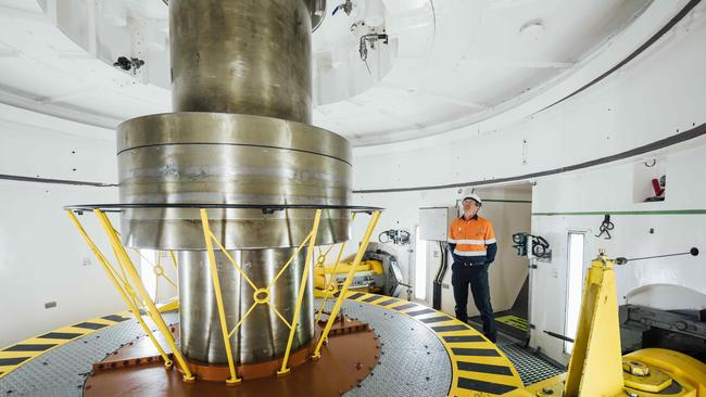 Snowy Hydro area manager, Guy Boardman watches a spinning turbine inside Tumut 3 Power Station in 2019. Photo by Rohan Thomson