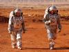 A couple of astronauts from a team from Europe and Israel walk in spacesuits during a training mission for planet Mars at a site that simulates an off-site station at the Ramon Crater in Mitzpe Ramon in Israel's southern Negev desert on October 10, 2021. - Six astronauts from Portugal, Spain, Germany, the Netherlands, Austria, and Israel will be cut off from the world for a month, from October 4-31, only able leave their habitat in spacesuits as if they were on Mars. Their mission, the AMADEE-20 Mars simulation, will be carried out in a Martian terrestrial analog and directed by a dedicated Mission Support Center in Austria, to conduct experiments ahead of future human and robotic Mars exploration missions. (Photo by JACK GUEZ / AFP)