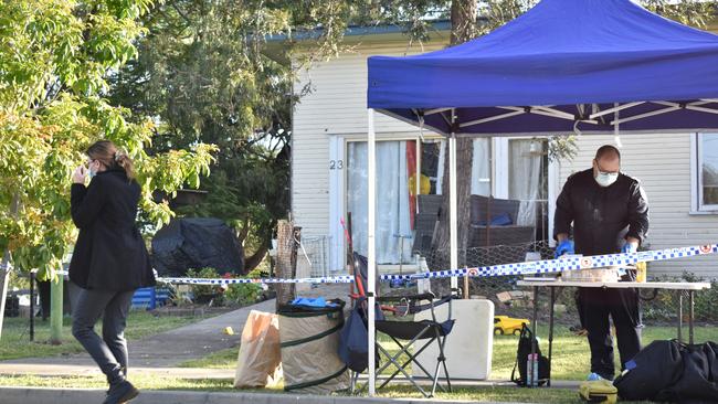 Forensics officers at the scene after Christopher Anderson was shot dead outside his home on Old Logan Rd, Gailes. Photo: Ebony Graveur