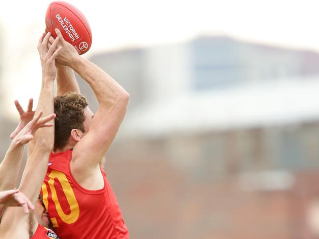 Brett Eddy flies for a pack mark in a state game. Picture: Norm Oorloff