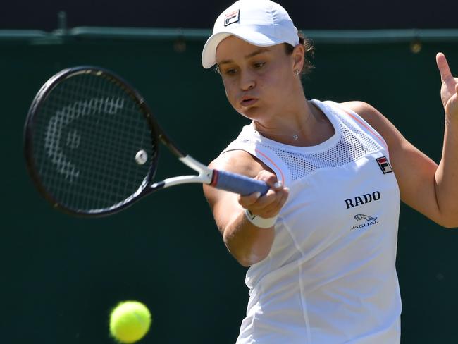 Australia's Ashleigh Barty returns against Belgium's Alison van Uytvanck during their women's singles second round match on the fourth day of the 2019 Wimbledon Championships at The All England Lawn Tennis Club in Wimbledon, southwest London, on July 4, 2019. (Photo by Ben STANSALL / AFP) / RESTRICTED TO EDITORIAL USE