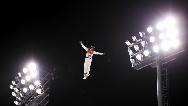 David Morris soars between the lights in the aerials final last night. Picture: Getty Images