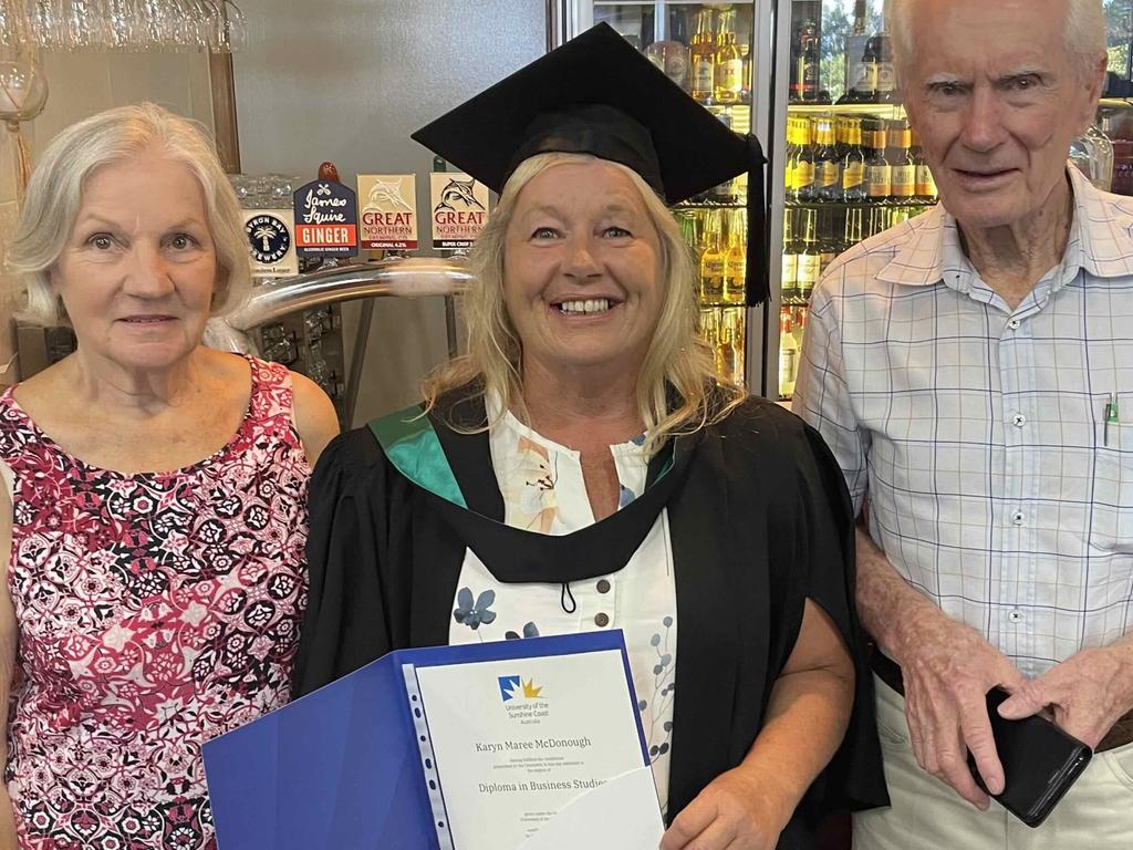 Business student Karyn McDonough with parents Geoff and Judy at the University of the Sunshine Coast graduation ceremony at the Beach House Hotel on October 12, 2023.