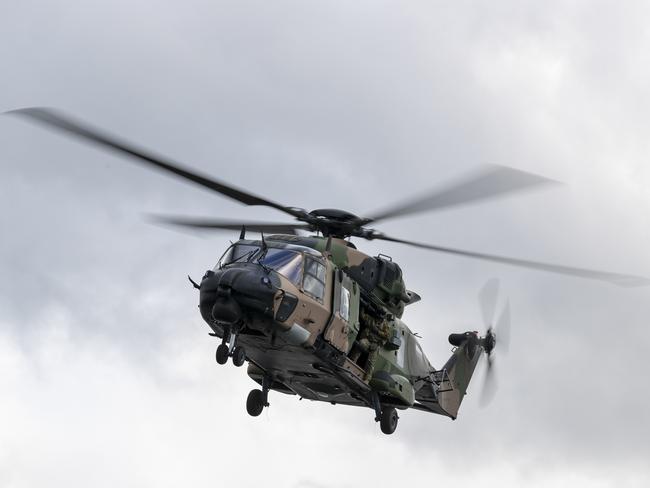 ***DAILY TELEGRAPH EXCLUSIVE MUST CHECK BEFORE USE*** ,  An Australian Army MRH-90 Taipan helicopter from 6th Aviation Regiment approaches a Sydney ferry as part of a Special Operations Command maritime counter-terrorism training activity in Sydney Harbour on Wednesday, 24 June 2020. *** Local Caption *** Australian Army special forces soldiers from 2nd Commando Regiment conducted Exercise Mars Toothfish in Sydney, Wollongong and associated New South Wales coastal waters from late-June to early July 2020.  Exercise Mars Toothfish is essential Australian Army training that ensures the Australian Defence Force is ready to defend Australia and its national interests. The training activity was conducted using strict COVID-19 protocols.  The Mars series of counter-terrorism training activities are designed to build and maintain the skills of 2nd Commando Regiment's Tactical Assault Group - East (TAG-East), a short-notice counter-terrorist force able to respond to a terrorist incident of national importance or in support of state and territory-based police.  2nd Commando Regiment is part of Special Forces Group, a brigade-level formation within the Australian Army's Special Operations Command.  Special Operations Command's mission is to prepare and employ special operations forces to defend Australia and its national interests.  Special Operations Command is a small, high-tempo and diverse multi-disciplinary team drawn from Navy, Army, Air Force, Australian Public Service and contractors who continue the 78 years of Australian special operations experience and sacrifice since World War II.