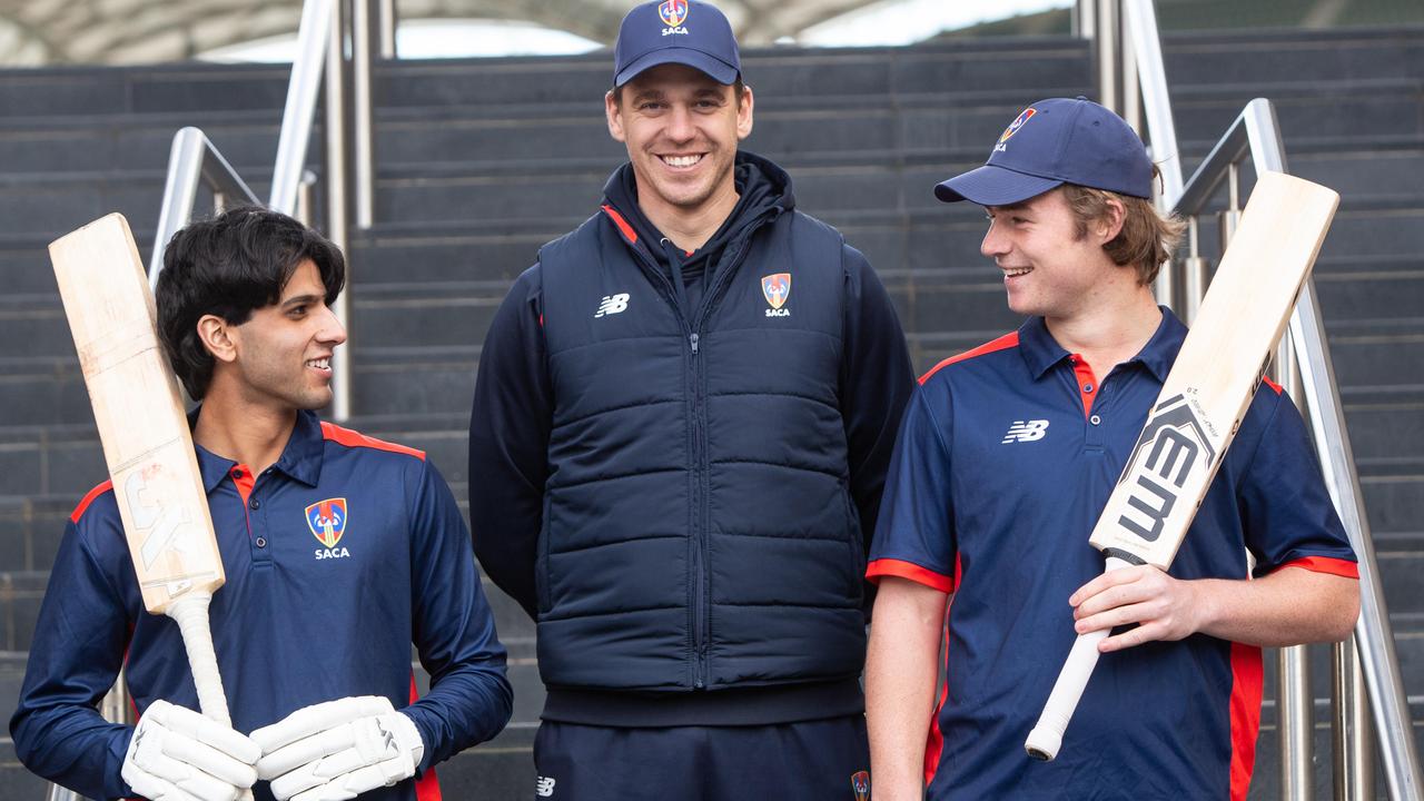 Kensington’s Jack Matchett (right) and Adelaide’s Tejas Gill with SACA under-19s coach Luke Butterworth. Picture: Brett Hartwig