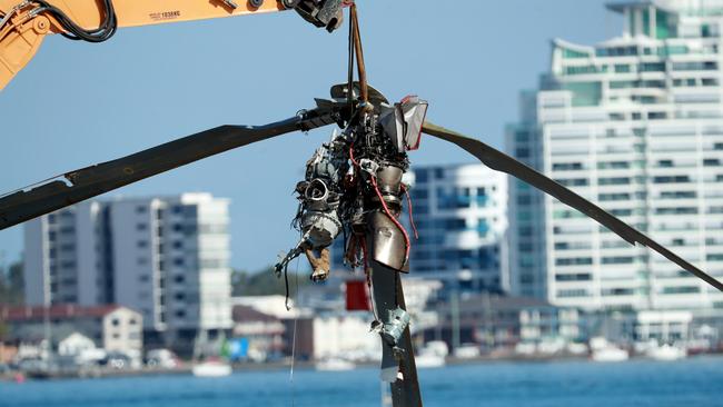 Wreckage is removed from the site. Picture: Scott Powick.