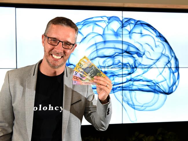 Behavioural economist Phil Slade says brains use procrastination to avoid pain. Photo: AAP/John Gass