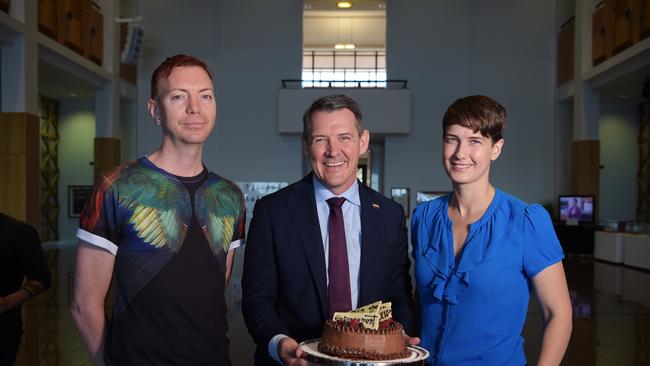 Local artist Matthew Van Roden, Territory Chief Minister Michael Gunner and human rights lawyer Anna Brown celebrate Mr Gunner’s apology to the LGBTQI community for historic laws in the NT that criminalised homosexuality Picture: KERI MEGELUS