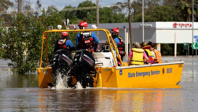 SES teams were ferrying residents around the streets in Forbes. Picture: Dean Marzolla