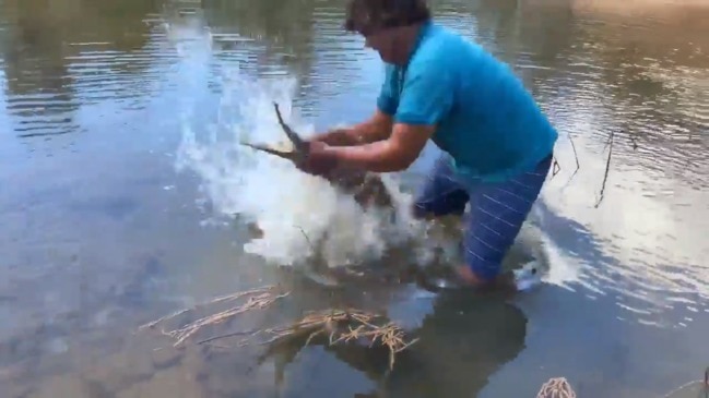 Man catches freshwater crocodile