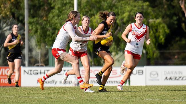 Cassie McWilliam's is tackled by Hayley Finning during Nightcliff and Waratah's Round 3 WPL clash. Picture: Jack Riddiford / AFLNT Media.