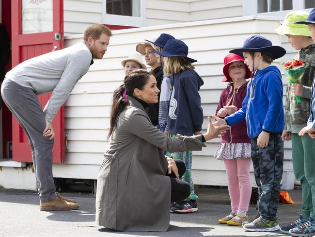 Prince Harry and Meghan chat with kids from Houghton Valley School. Picture: AAP