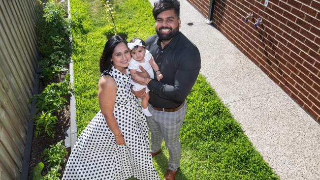 Family of three, Navdeep Singh, Shallu Taneja, and there five months old Arroyo Kaur Saini. Story is about changing state of Melbourne homes, particularly backyards. Navdeep estimates his is somewhere around 50sqm which is smaller than the wicket pitch of an average cricket ground. It's also pretty close to standard these days. Picture: Tony Gough