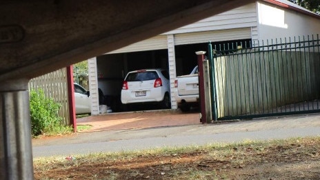 Pictures submitted in court from the Toowoomba Regional Council, which shows them photographing Grant Forde's place of business and his parent's house. The photo appears to be taken from under a park bench.