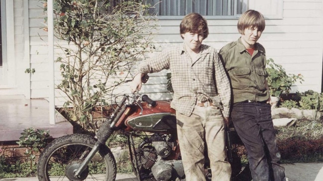 Wayne Gardner, left, with a childhood friend and his first motorbike.