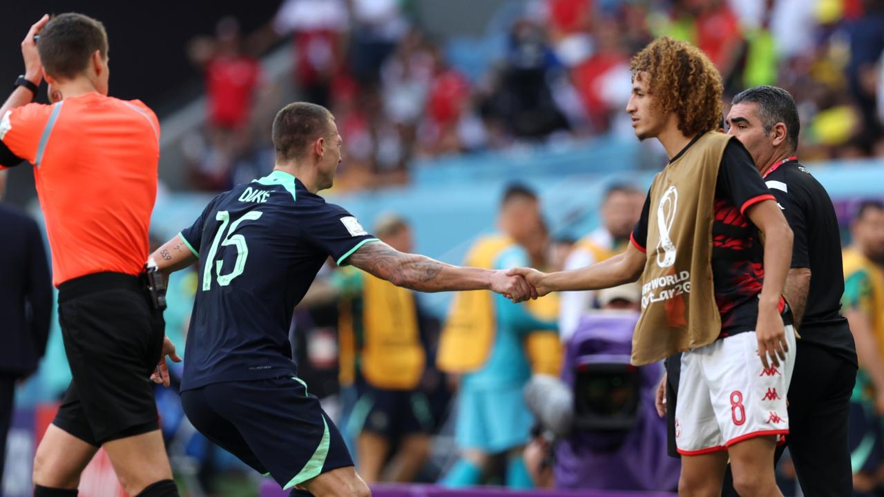 AL WAKRAH, QATAR – NOVEMBER 26: Mitchell Duke of Australia and Hannibal Mejbri of Tunisia shake hands after an argument during the FIFA World Cup Qatar 2022 Group D match between Tunisia and Australia at Al Janoub Stadium on November 26, 2022 in Al Wakrah, Qatar. (Photo by Clive Brunskill/Getty Images)