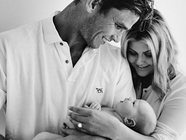 Fatherhood has helped Tom Hawkins, pictured with wife Emma and baby Arabella, mature as a man and footballer.