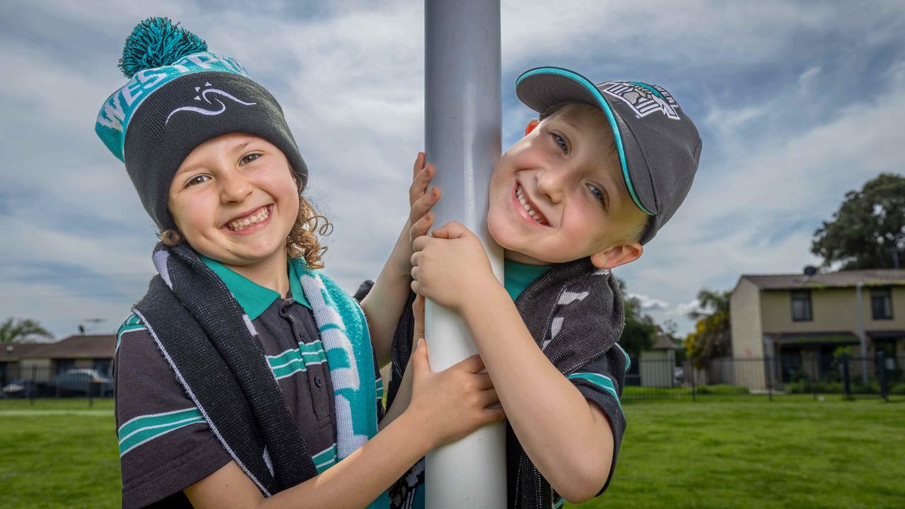 Westport Primary School Power Fans Imogen and Louis are hoping for a big win over Hawthorn. Picture: Ben Clark