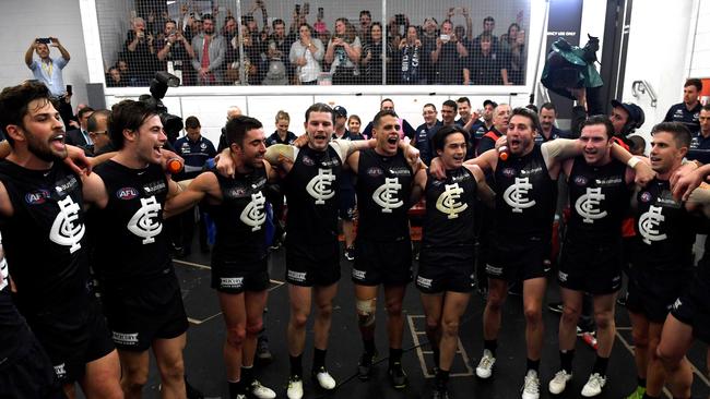 Carlton players sing the song after their win over Gold Coast in 2017. Pic. AAP Image/Dave Hunt