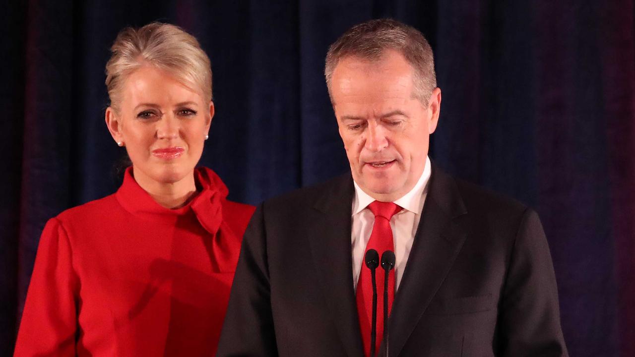 Bill Shorten delivers his concession speech to Labor Party faithful, supported by wife Chloe, in Melbourne last night. Picture: Getty Images