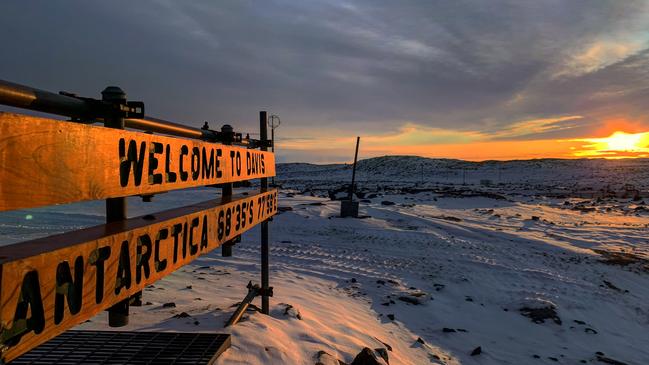 Sunrise at Davis welcome sign. Picture: David Knoff/Australian Antarctic Division