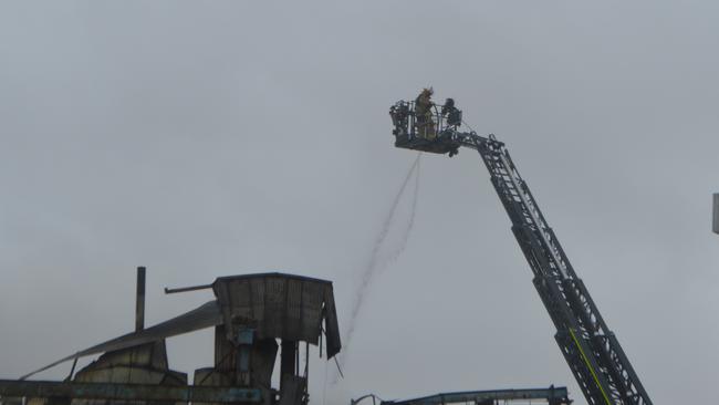 Aerial crews containing the fire at Allora Grain and Milling ,