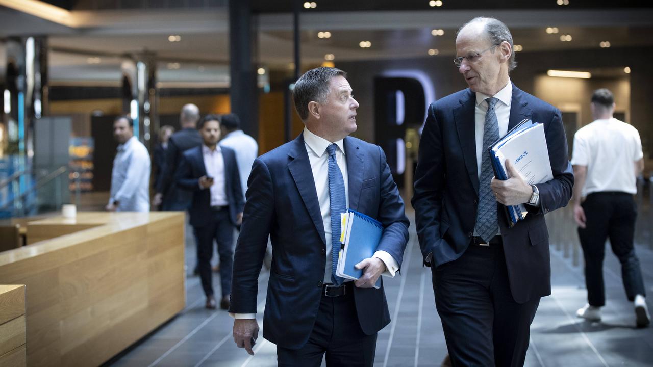 ANZ CEO Shayne Elliott, right, and institutional boss Mark Whelan could see big cuts to their pay packets this year. Picture: Arsineh Houspian