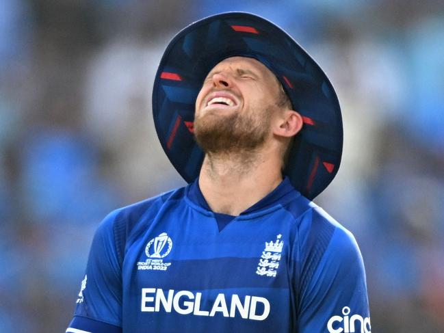 England's David Willey reacts after he was hit by the ball during the 2023 ICC Men's Cricket World Cup one-day international (ODI) match between India and England at the Ekana Cricket Stadium in Lucknow on October 29, 2023. (Photo by Sajjad HUSSAIN / AFP) / -- IMAGE RESTRICTED TO EDITORIAL USE - STRICTLY NO COMMERCIAL USE --