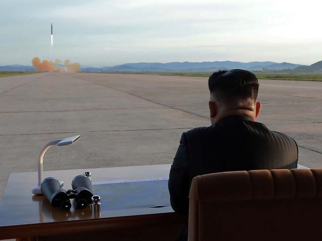 North Korean leader Kim Jong-un inspects a launch drill of the medium-and-long range strategic ballistic rocket Hwasong-12 at an undisclosed location. Picture: AFP/KCNA via KNS